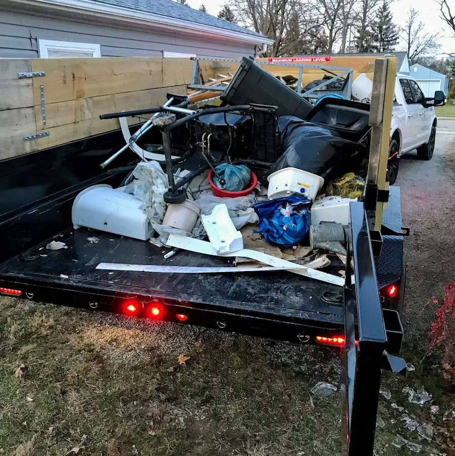 Roll-off dumpster delivered to a residential driveway in Del City